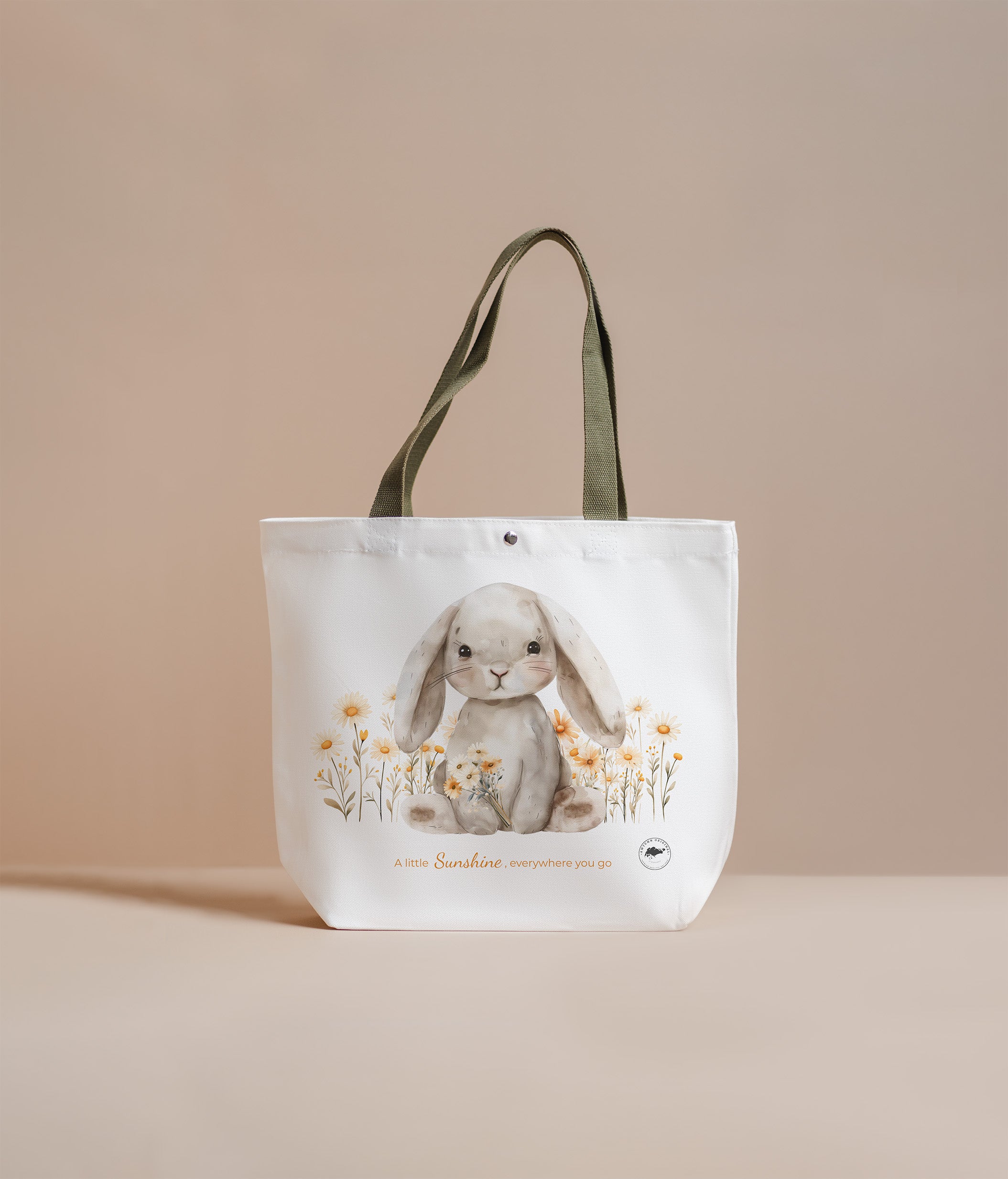 Tote bag with a rabbit design on a beige background