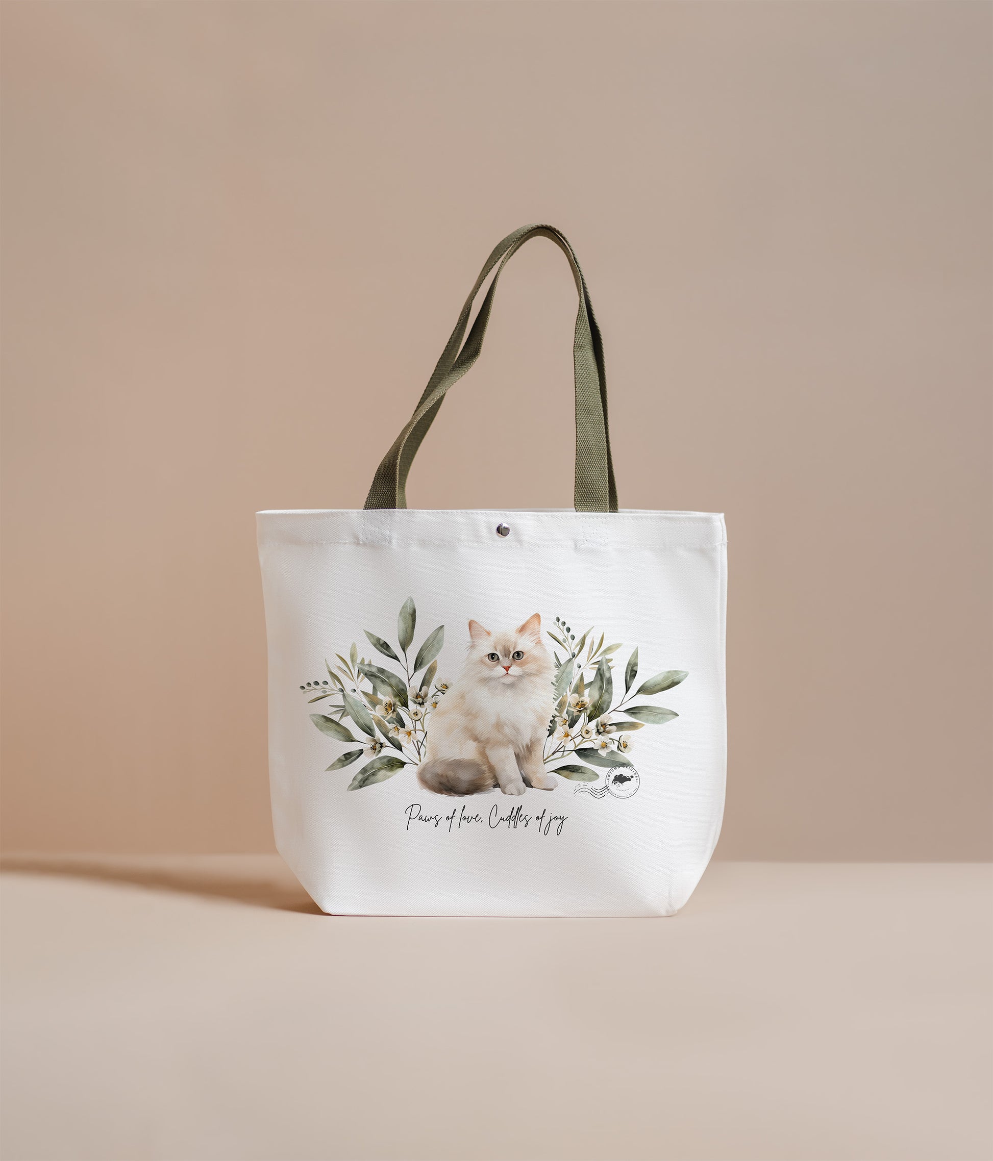 Tote bag with a cat design and text on a beige background