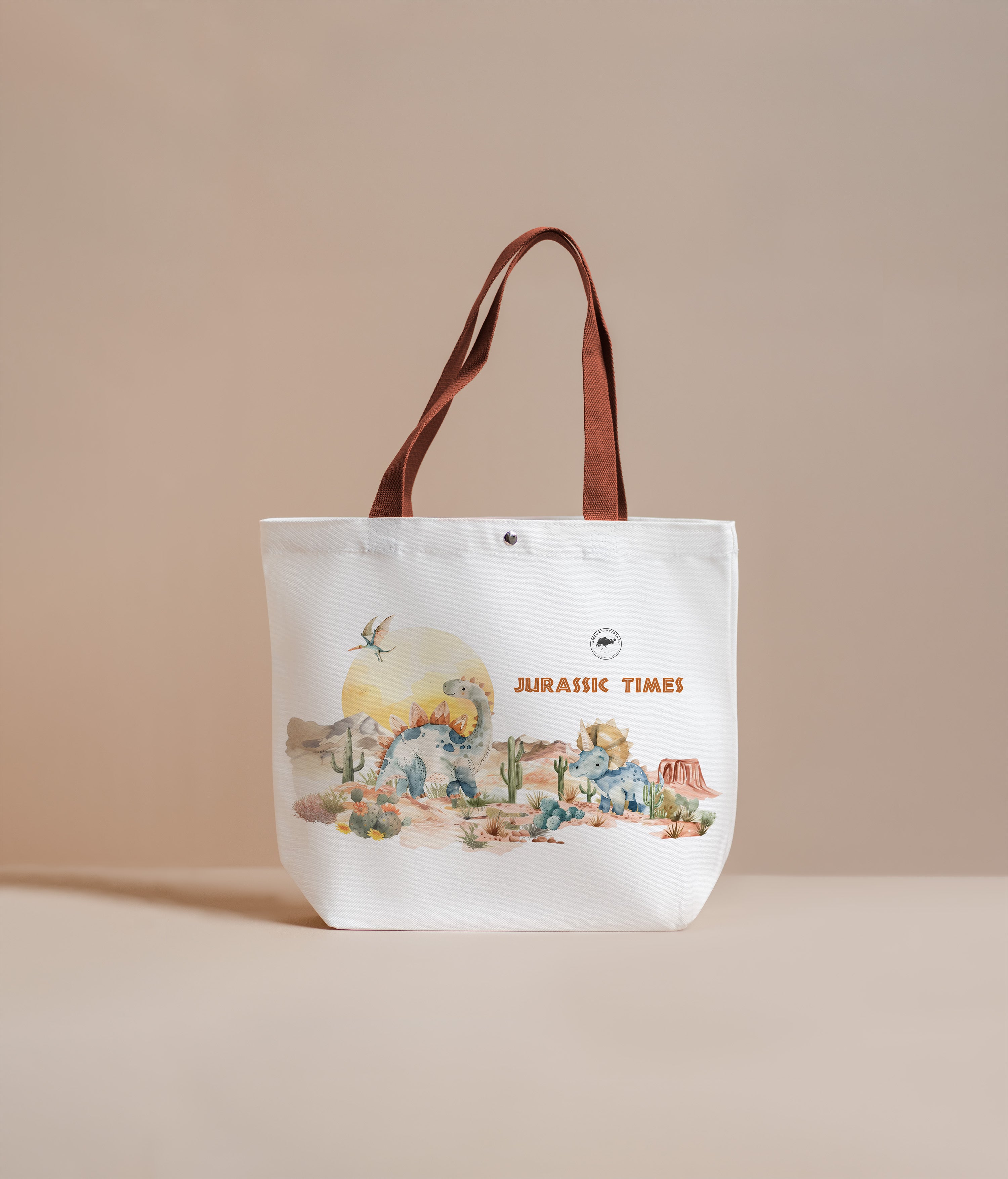 Tote bag with dinosaur illustration and 'Jurassic Times' text on a beige background