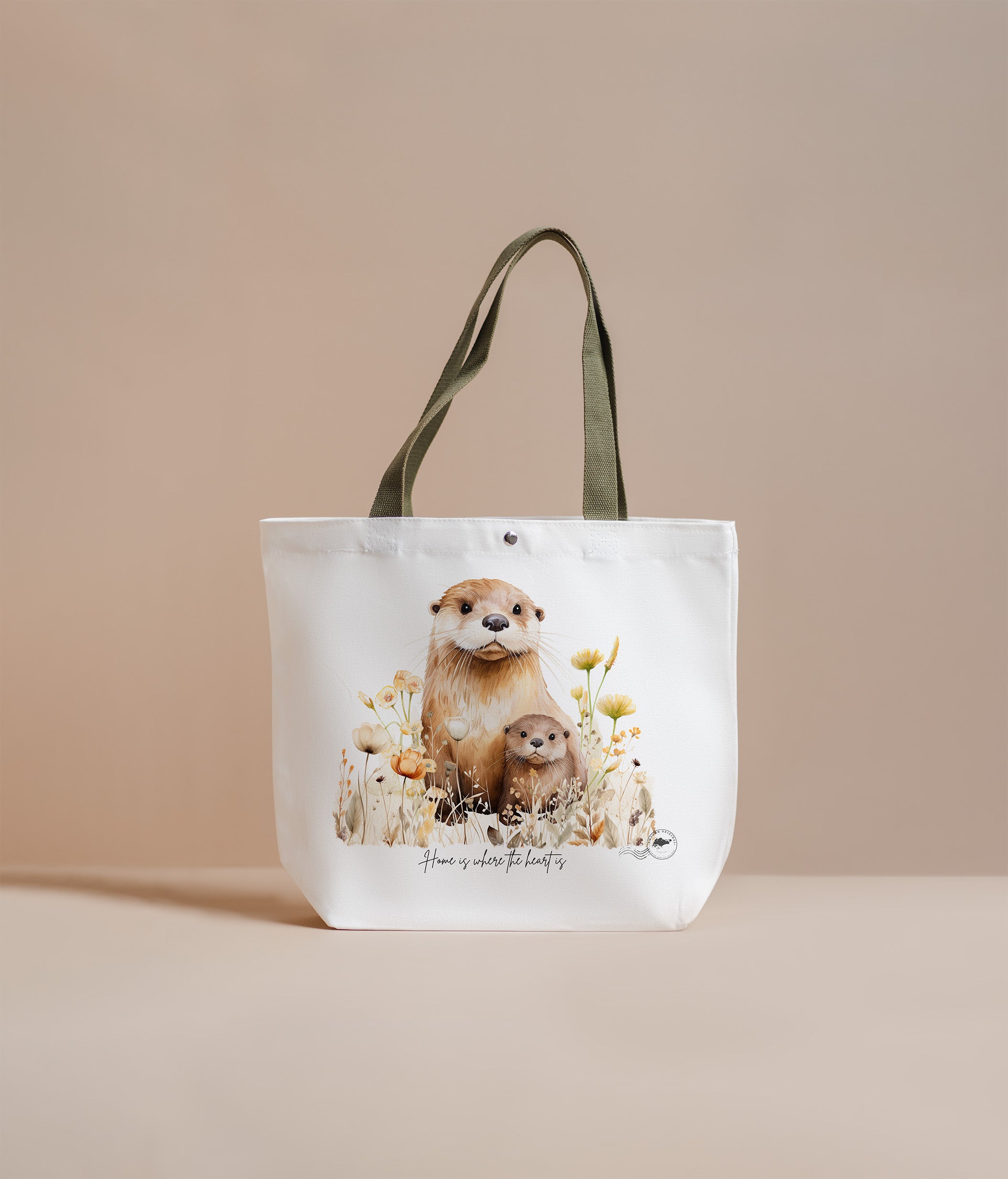 Tote bag with otter design and text on a beige background