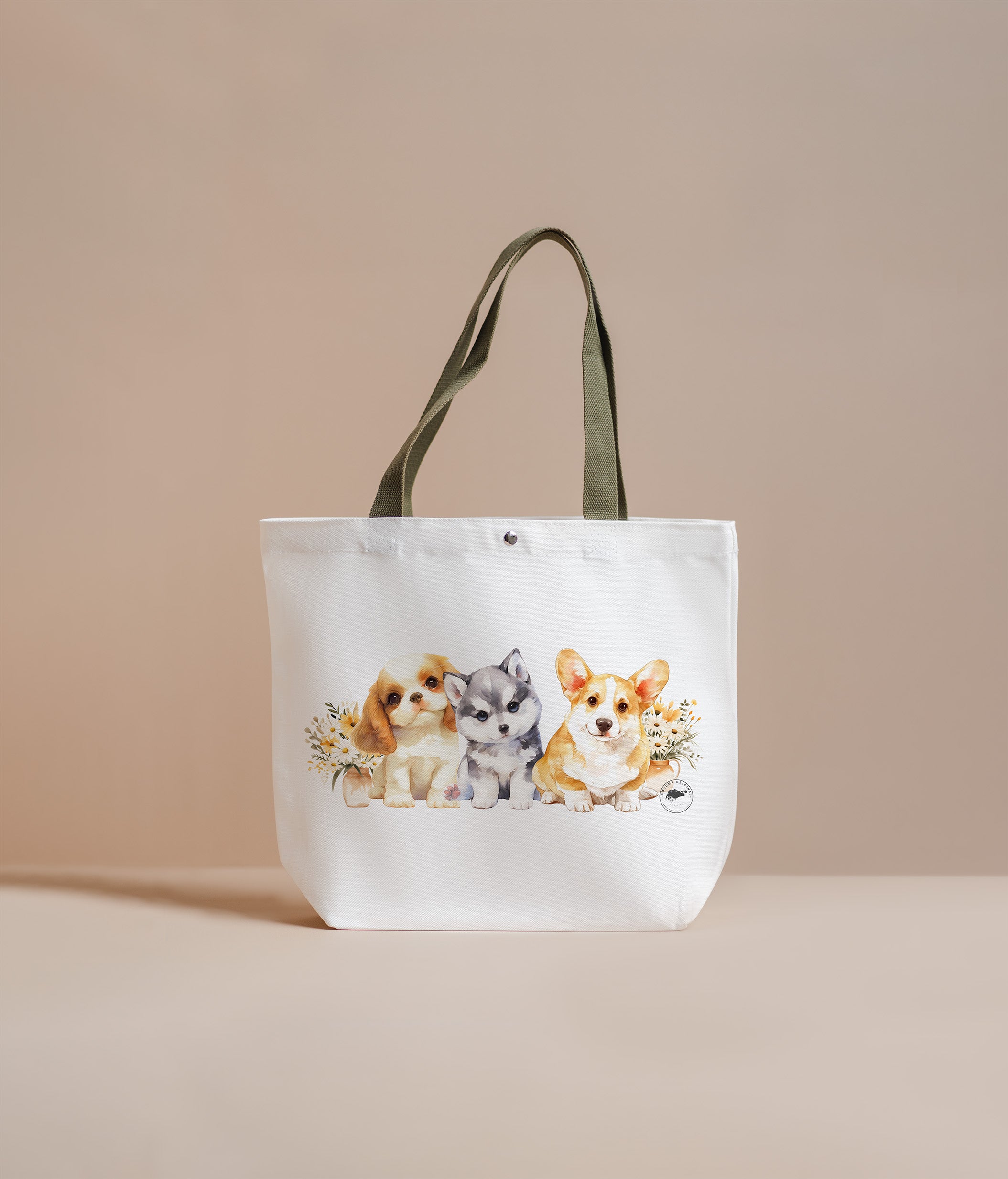 Tote bag with illustrations of three dogs on a beige background