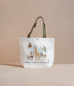 Tote bag with illustrations of animals and 'Wildlife Wonders of Singapore' text on a beige background
