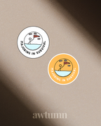 Two 'Majoring in Survival' stickers on a beige background with 'awtumn' branding.